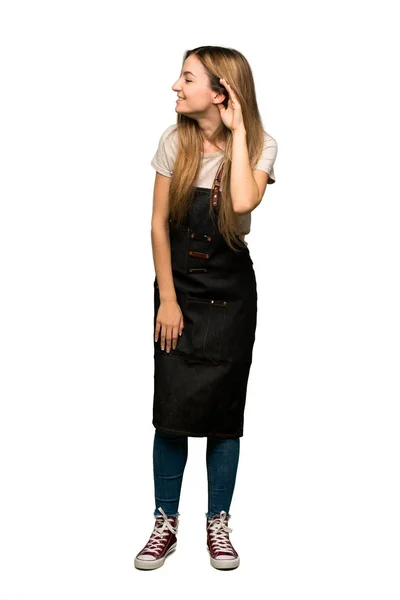Full Body Young Woman Apron Listening Something Putting Hand Ear — Stock Photo, Image