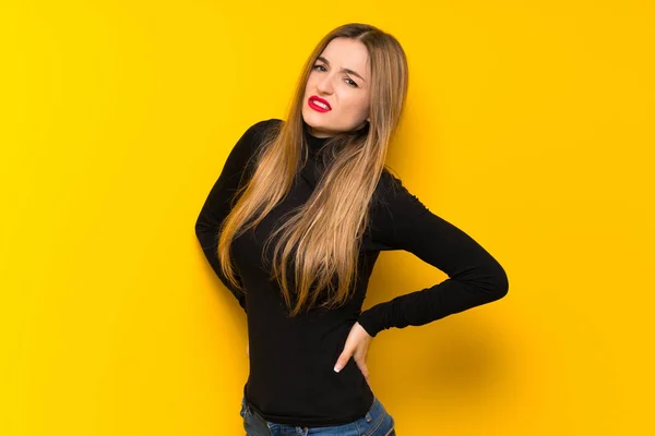 Young Pretty Woman Yellow Background Suffering Backache Having Made Effort — Stock Photo, Image