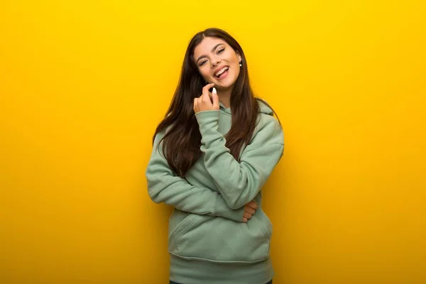 Teenager Girl Green Sweatshirt Yellow Background Smiling Sweet Expression — Stock Photo, Image