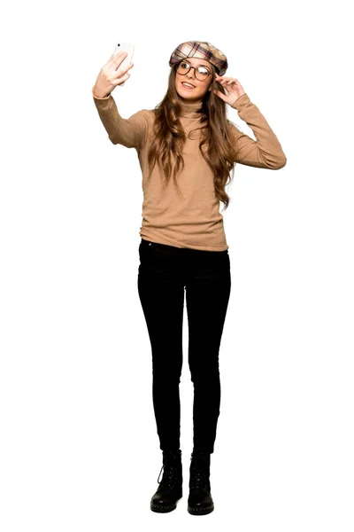 Full Length Shot Young Woman Beret Happy Pointing Mobile Isolated — Stock Photo, Image