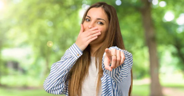 Young Girl Striped Shirt Pointing Finger Someone Laughing Outdoors — Stock Photo, Image