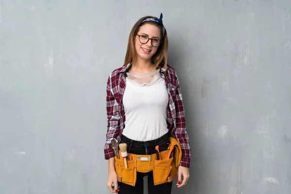 Craftsmen or electrician woman with glasses and happy