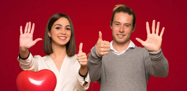 Couple Valentine Day Counting Six Fingers Red Background — Stock Photo, Image