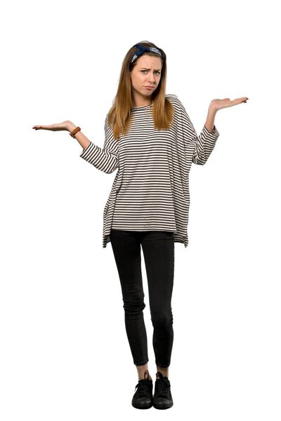 A full-length shot of a Young woman with headscarf having doubts while raising hands over isolated white background
