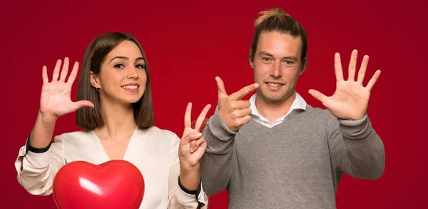 Couple Valentine Day Counting Seven Fingers Red Background — Stock Photo, Image