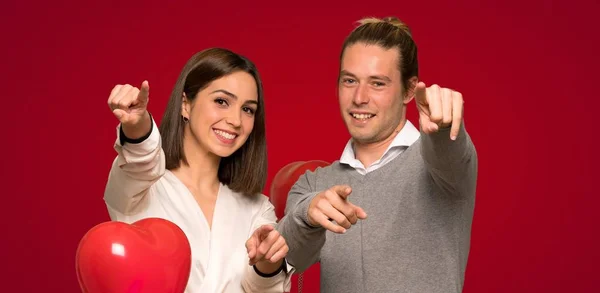 Couple Valentine Day Points Finger You While Smiling Red Background — Stock Photo, Image