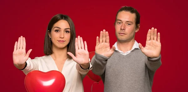Couple Valentine Day Making Stop Gesture Disappointed Opinion Red Background — Stock Photo, Image