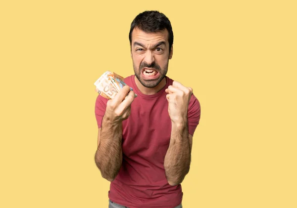 Man Taking Lot Money Frustrated Bad Situation Isolated Yellow Background — Stock Photo, Image