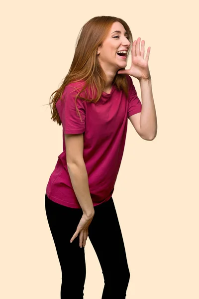 Young Redhead Girl Shouting Mouth Wide Open Lateral Isolated Yellow — Stock Photo, Image