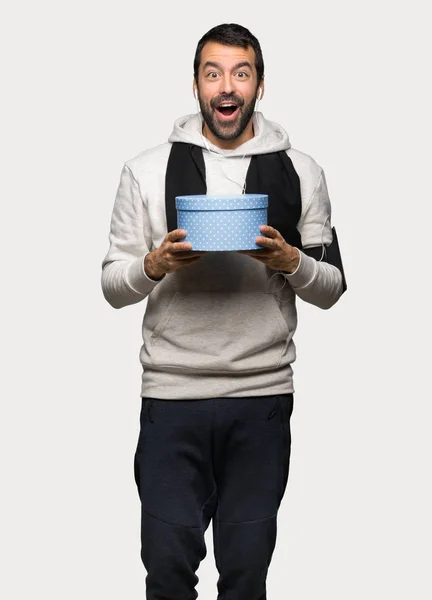 Sport Man Surprised Because Has Been Given Gift Isolated Grey — Stock Photo, Image