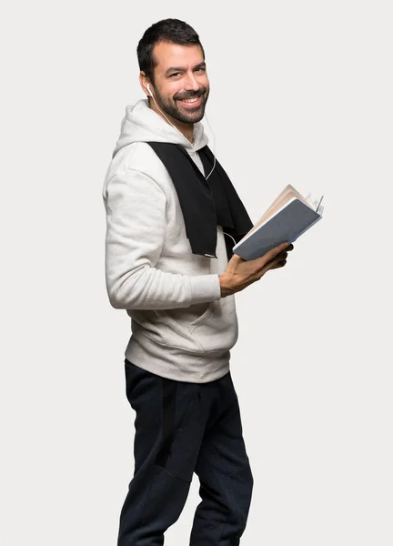 Sport Man Holding Book Enjoying Reading Isolated Grey Background — Stock Photo, Image