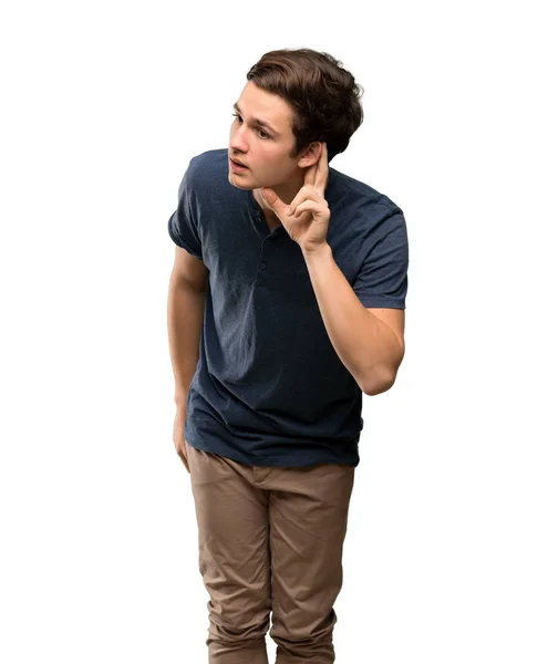 Hombre Adolescente Escuchando Algo Poniendo Mano Oreja Sobre Fondo Blanco —  Fotos de Stock