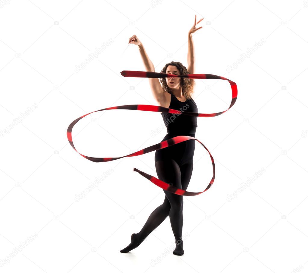 Woman doing rhythmic gymnastics with ribbon on isolated white background