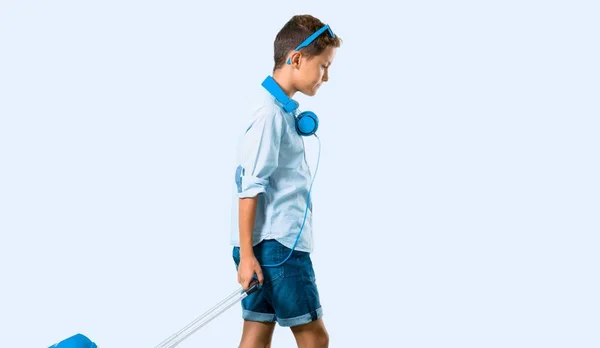 Boy Sunglasses Headphones Traveling His Suitcase Blue Background — Stock Photo, Image