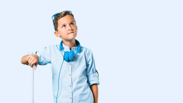 Kid Sunglasses Headphones Traveling His Suitcase Having Doubts Confuse Face — Stock Photo, Image