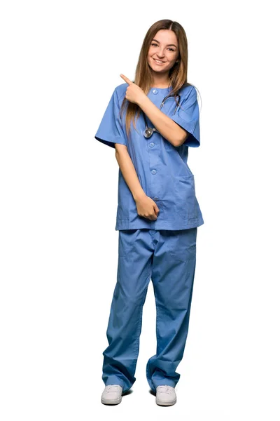 Full Body Young Nurse Pointing Side Present Product Isolated Background — Stock Photo, Image