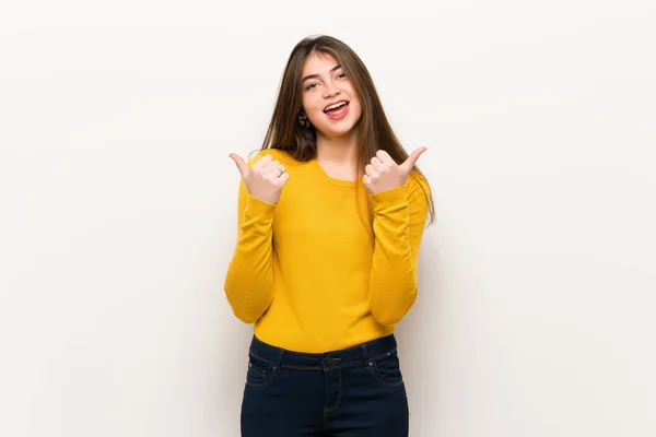 Young Woman Yellow Sweater Giving Thumbs Gesture Both Hands Smiling — Stock Photo, Image