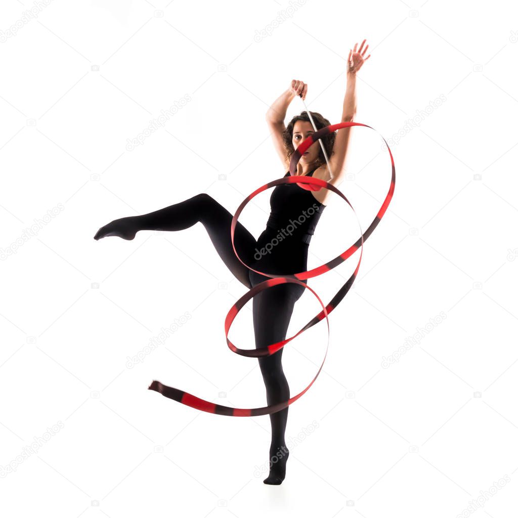 Woman doing rhythmic gymnastics with ribbon on isolated white background