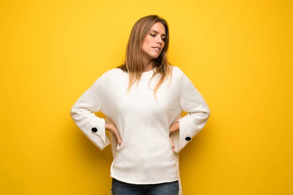 Blonde Woman Yellow Wall Suffering Backache Having Made Effort — Stock Photo, Image