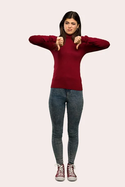 Full Length Shot Teenager Girl Turtleneck Showing Thumb Isolated Background — 图库照片