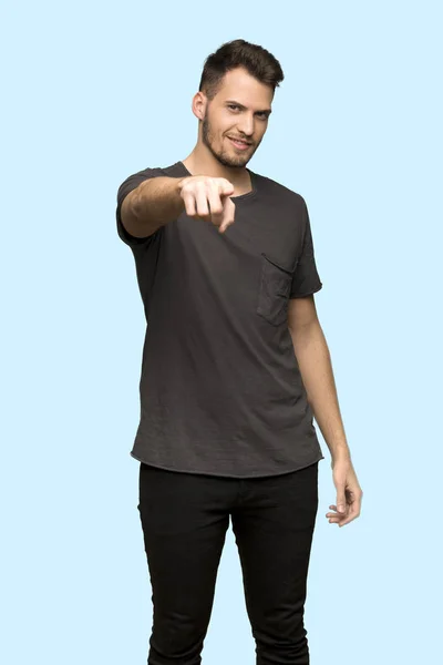 Man Black Shirt Points Finger You Confident Expression Blue Background — Stock Photo, Image