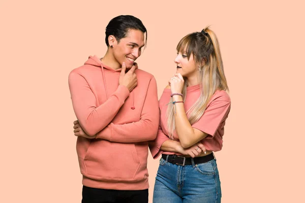 Young Couple Looking Side Hand Chin Pink Background — Stock Photo, Image