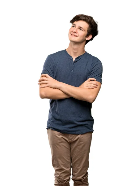 Teenager Mann Blickt Auf Während Über Isolierten Weißen Hintergrund Lächelt — Stockfoto