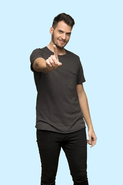 Man Black Shirt Showing Lifting Finger Blue Background — Stock Photo, Image