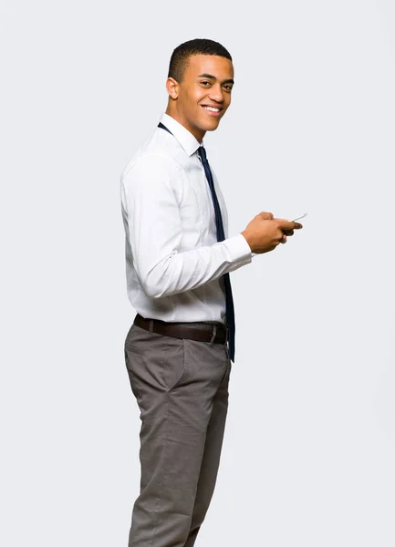 Young Afro American Businessman Sending Message Mobile Isolated Background — Stock Photo, Image