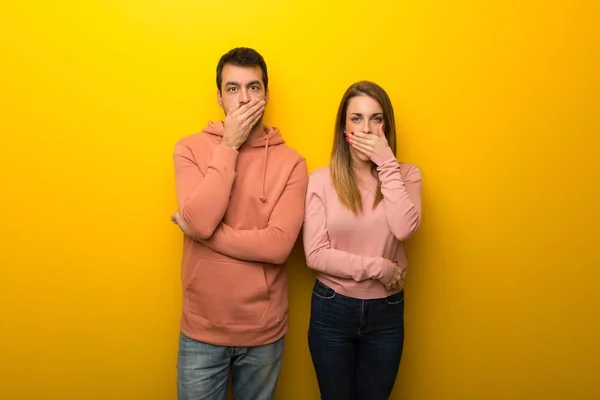 Group Two People Yellow Background Covering Mouth Hands Saying Something — Stock Photo, Image