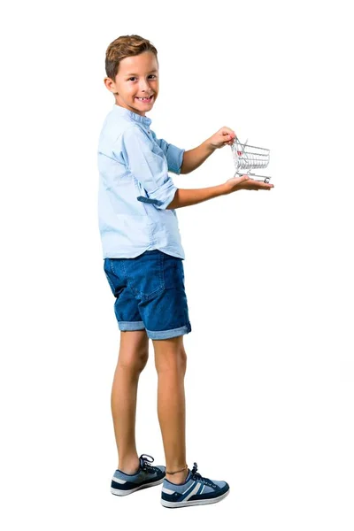 Little Kid Holding Supermarket Cart Toy Isolated White Background — Stock Photo, Image