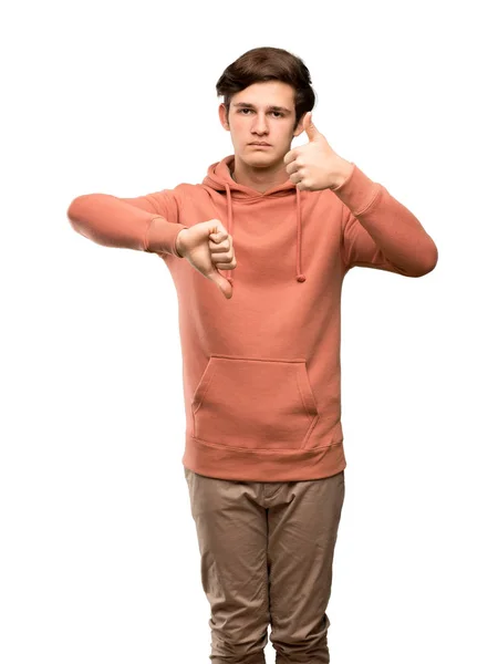 Teenager Mann Mit Sweatshirt Der Ein Gut Böse Zeichen Setzt — Stockfoto