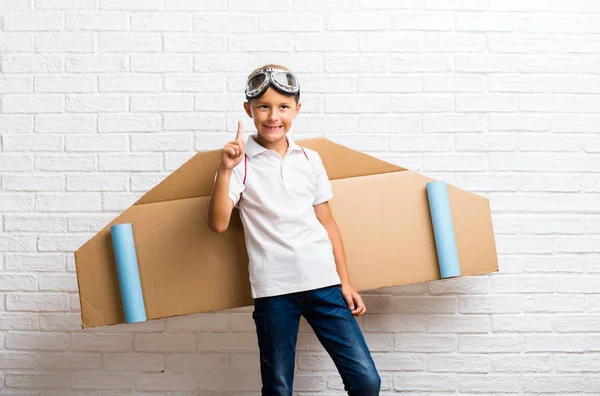 Boy Playing Cardboard Airplane Wings His Back Counting Number One — Stock Photo, Image