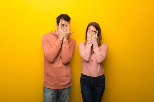 Group Two People Yellow Background Covering Eyes Hands Looking Fingers — Stock Photo, Image