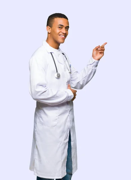 Young Afro American Man Doctor Pointing Finger Side Lateral Position — Stock Photo, Image