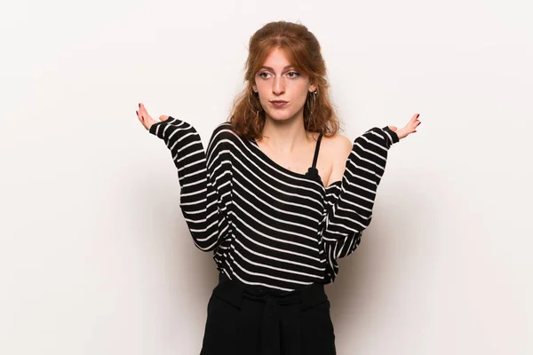 Young Redhead Woman White Wall Having Doubts While Raising Hands — Stock Photo, Image
