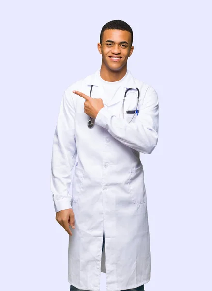 Young Afro American Man Doctor Pointing Side Present Product Isolated — Stock Photo, Image