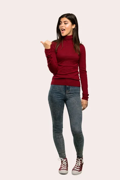 Full Length Shot Teenager Girl Turtleneck Pointing Side Present Product — Stock Photo, Image