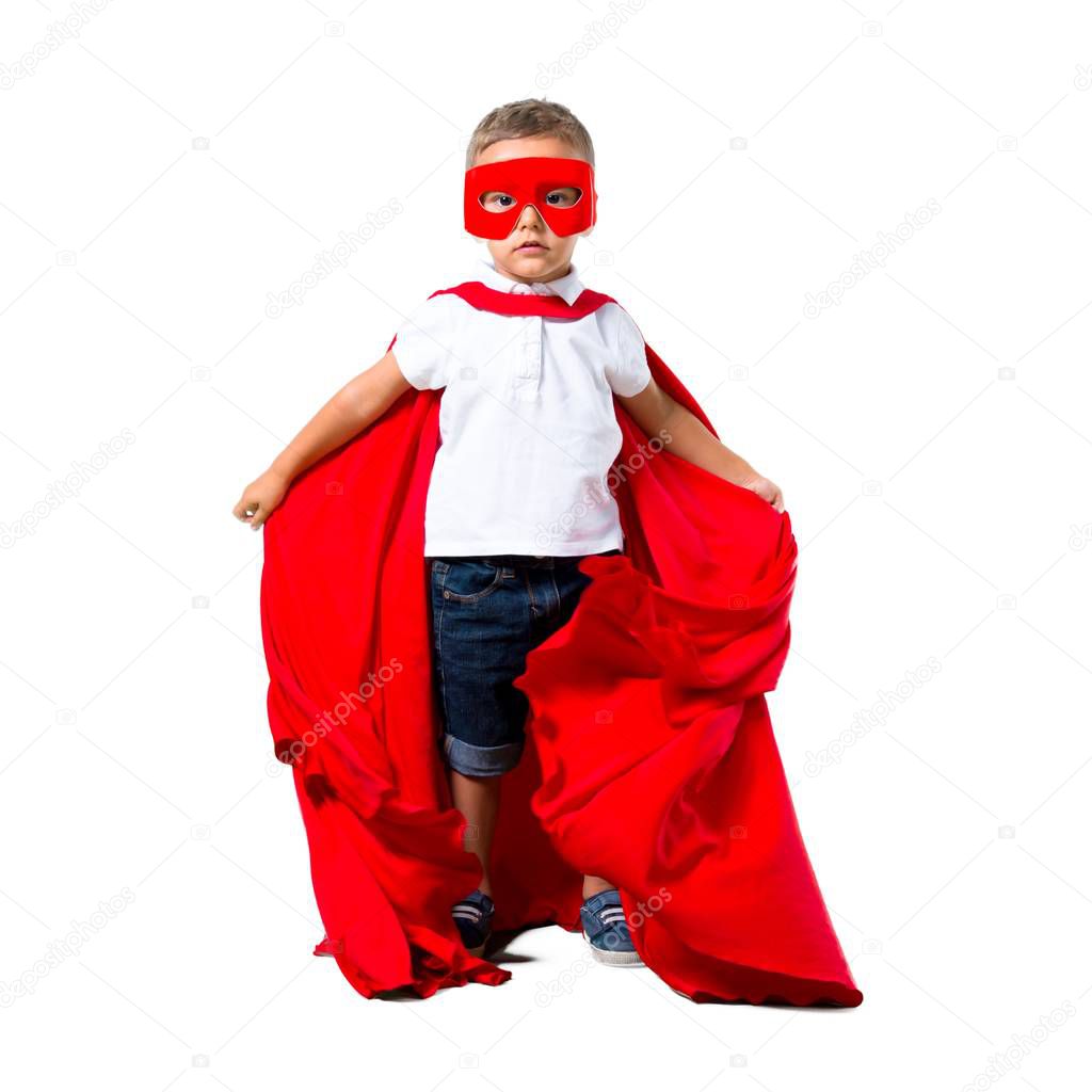 Little kid dressed like superhero on isolated white background