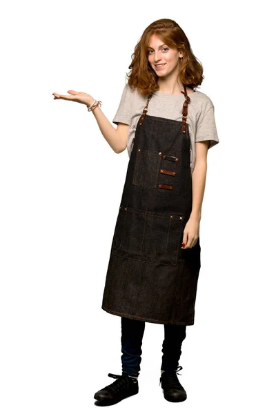 Full Length Shot Young Redhead Woman Apron Holding Copyspace Imaginary — Stock Photo, Image