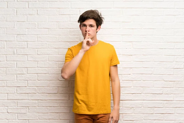 Teenager Man White Brick Wall Showing Sign Silence Gesture Putting — Stock Photo, Image