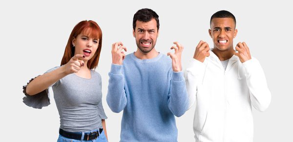 Group of three friends annoyed angry in furious gesture