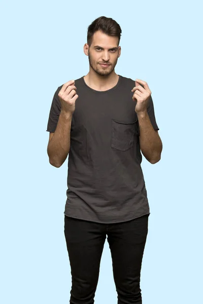 Man Black Shirt Making Money Gesture Blue Background — Stock Photo, Image