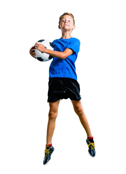 Полнометражный Снимок Мальчика Играющего Футбол Прыгающего Изолированном Белом Фоне — стоковое фото