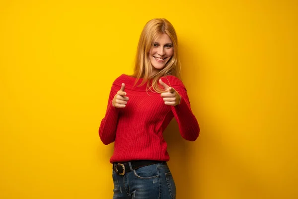 Blonde Woman Yellow Wall Pointing Front Smiling — Stock Photo, Image