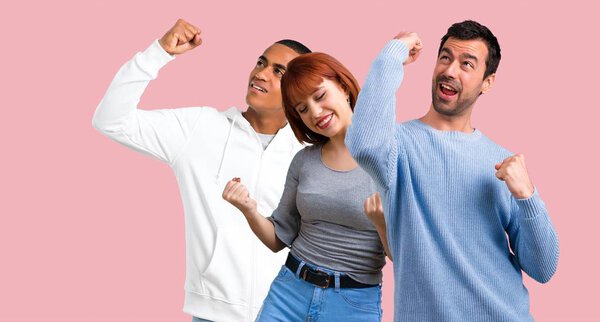 Group of three friends celebrating a victory