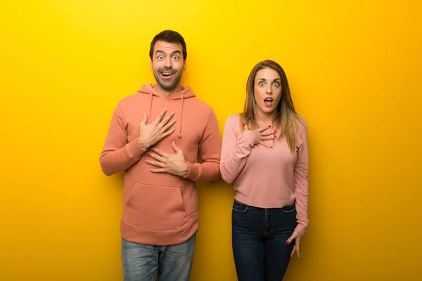 Group Two People Yellow Background Surprised Shocked While Looking Right — Stock Photo, Image