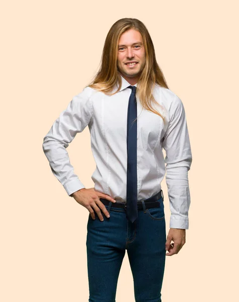 Blond Businessman Long Hair Posing Arms Hip Smiling Isolated Background — Stock Photo, Image