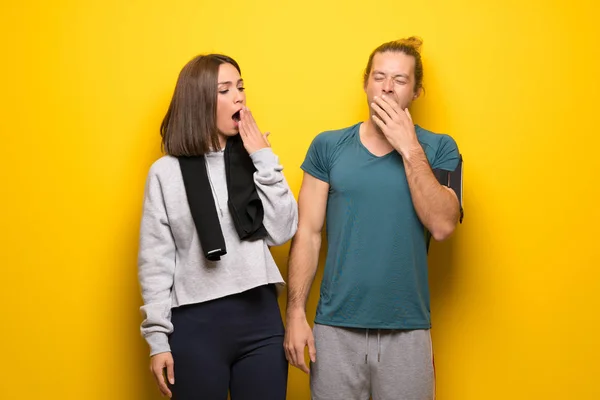 Group Athletes Yellow Background Yawning Covering Wide Open Mouth Hand — Stock Photo, Image