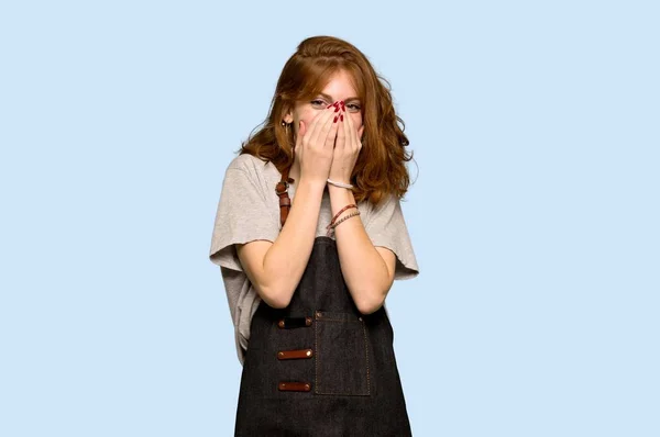 Young Redhead Woman Apron Smiling Lot While Covering Mouth Blue — Stock Photo, Image